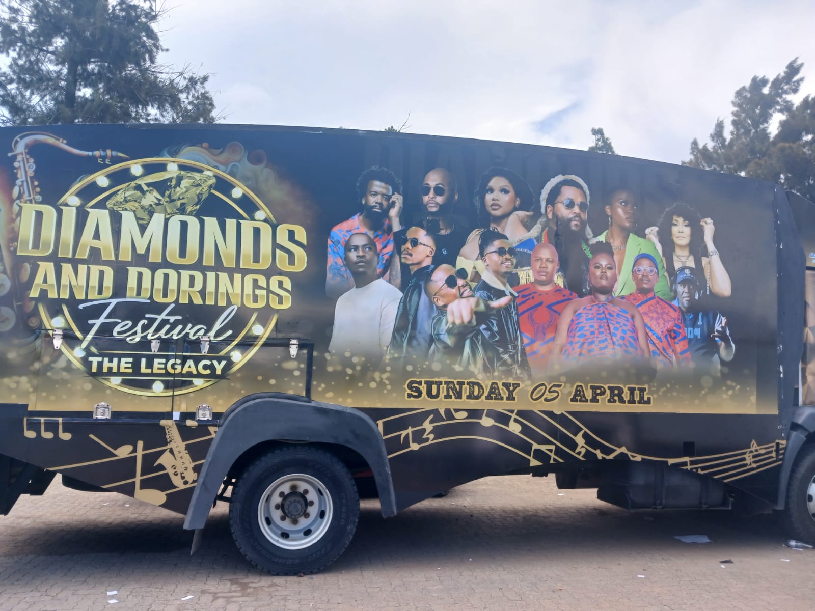 Black and gold mobile stage branding for the Diamonds and Dorings festival